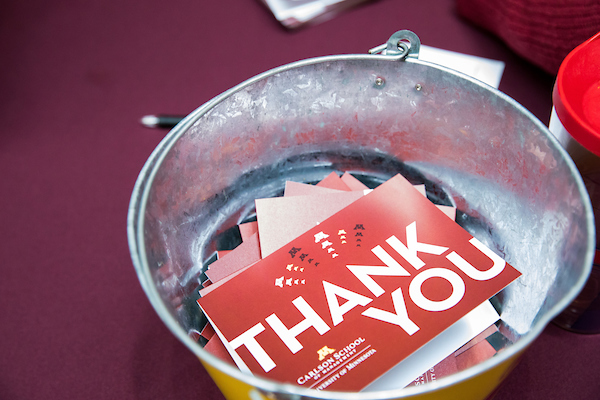 Bucket of maroon and white thank you cards.