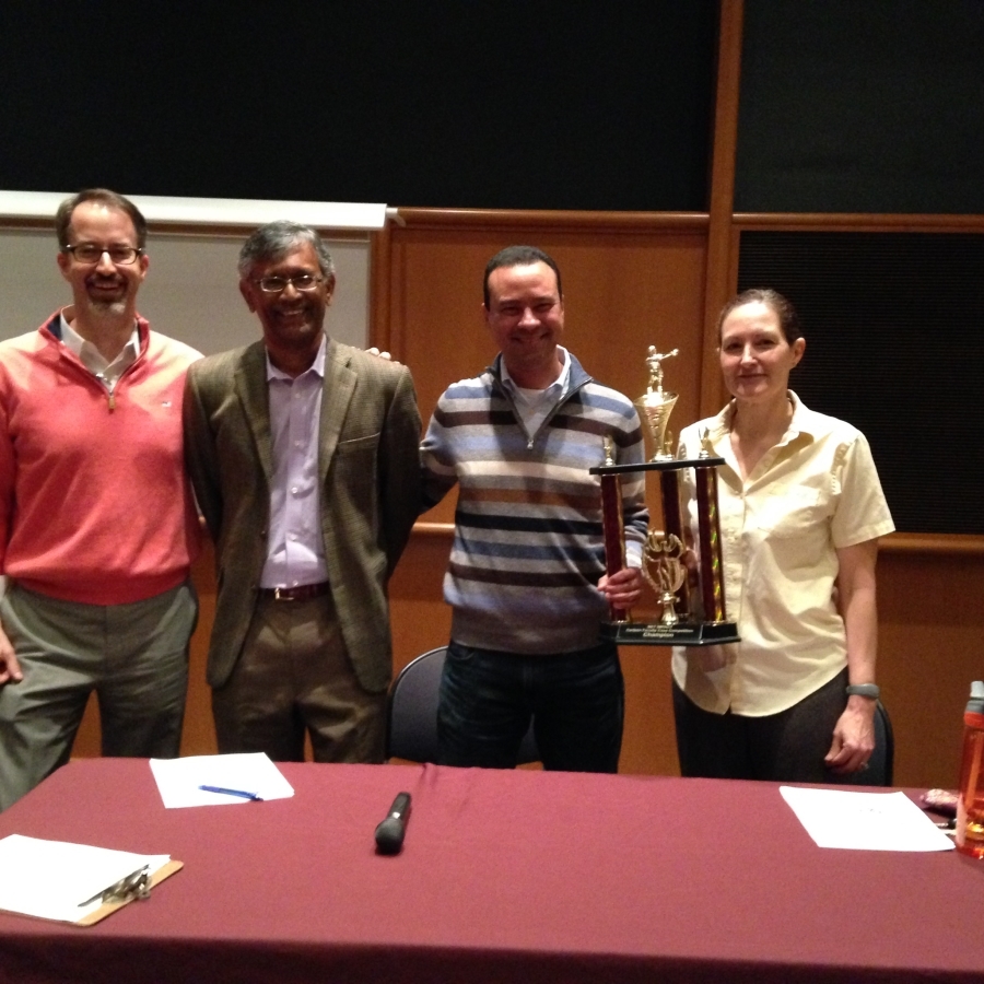 Faculty Holding Trophy