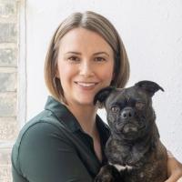 Katherine Ellison headshot with dog