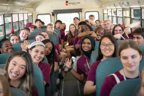 Class of 2027 Carlson undergraduates on a bus.