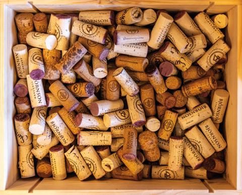 Wine corks in a wood crate.