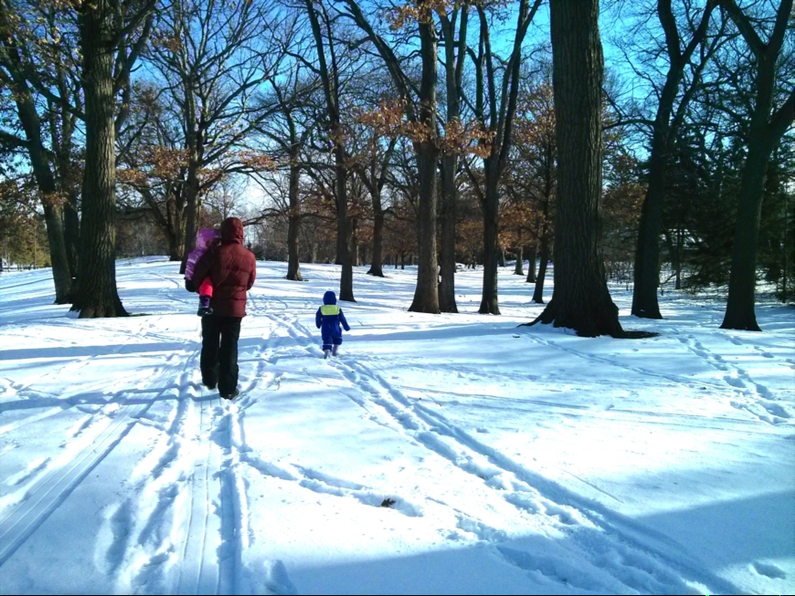 Family Walking Through Snow
