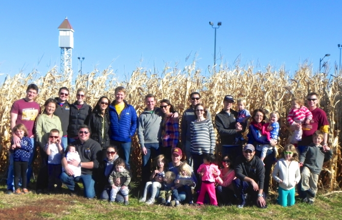 Families Posed in Front of Corn Maze