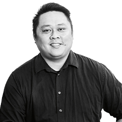 Faces of Carlson: Black and white photo of Chinh Truong, Academic Advisor
