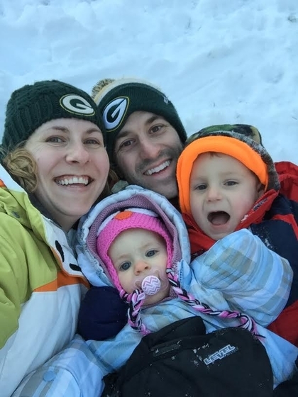 Family of 4 Smiling in the Snow