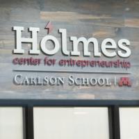 An image of the Holmes Center for Entrepreneurship sign at the Carlson School of Management.