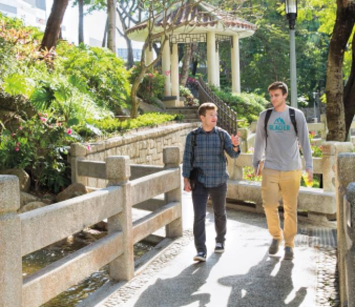 Students walking at City University of Hong Kong. Scholarship support for students is critical to their Carlson School experience.