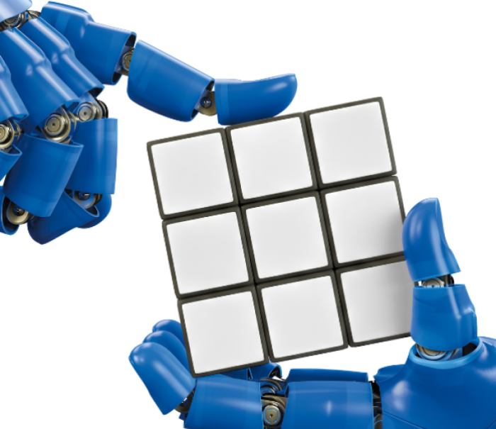 Robot hands holding Rubik's Cube.