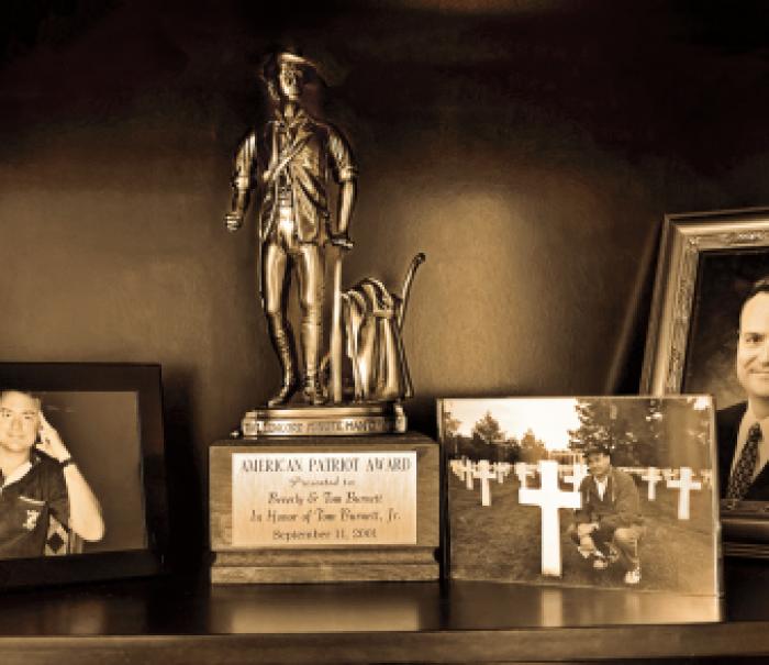 Pictures and awards on a table dedicated to Tom Burnett, ’86 BSB, a 9/11 hero.