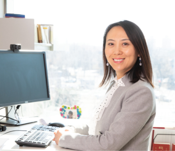 Tracy Wang at her desk.
