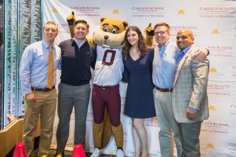 Group of people posing for a picture with Goldy Gopher.