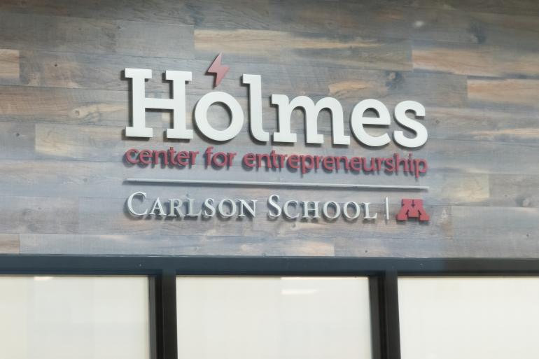 An image of the Holmes Center for Entrepreneurship sign at the Carlson School of Management.