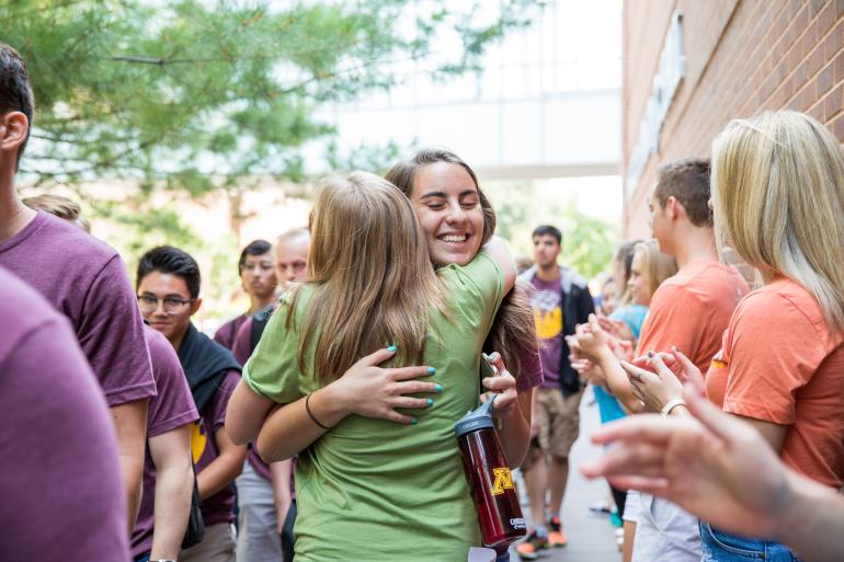 Two undergraduate students hugging during Welcome Week