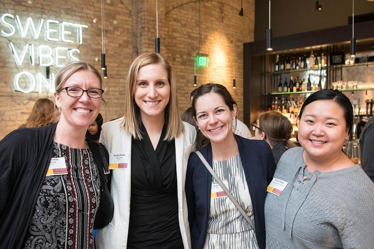 Four alum post together at the Carlson Women Connect event in Minneapolis.