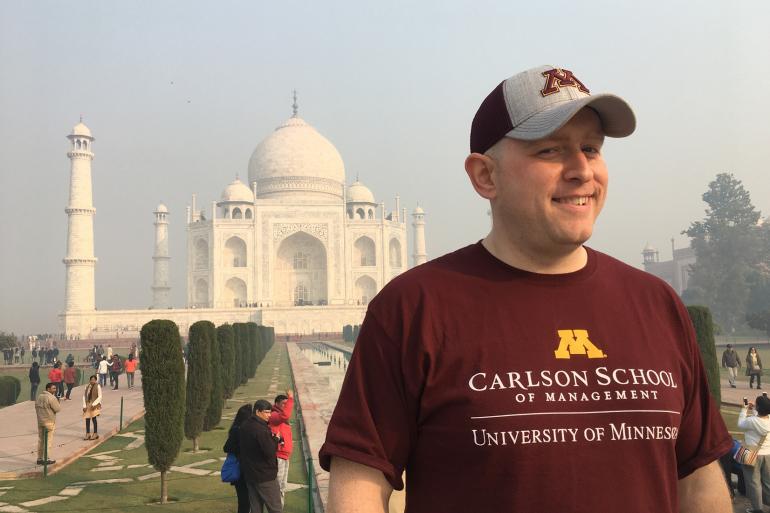 Stephen Drott posing for camera with Taj Mahal in background