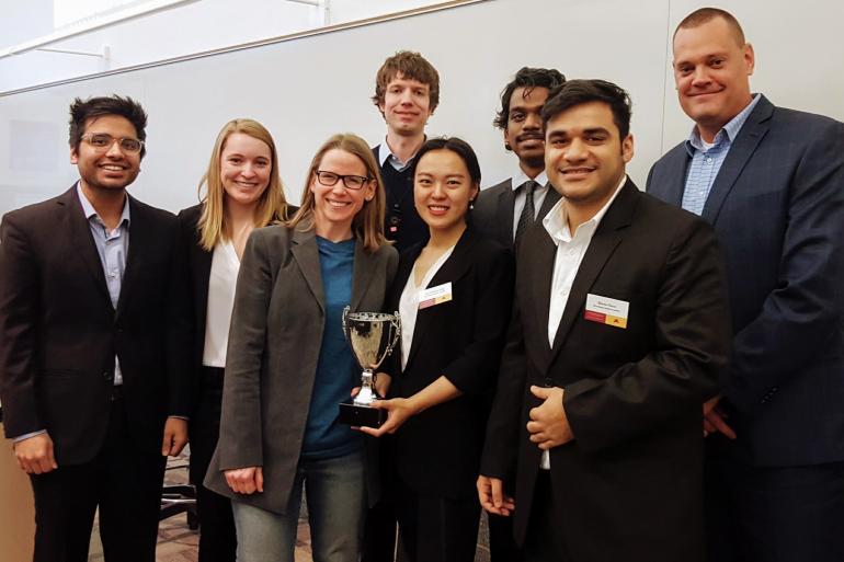 Winners of the exploratory analytics case with clients from Mall of America, from left: Utkarsh Khandelwal, Rachel Wolfe, Janette Smrcka and Phil MacDonald from Mall of America, Chelsea Hui Dong, John Arul Selvam, Bhuvan Oberoi, and Brian Spielman (MOA).