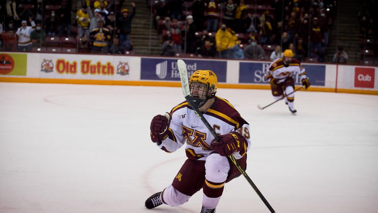 Ben Meyers celebrates after scoring a goal for the Gopher hockey team.