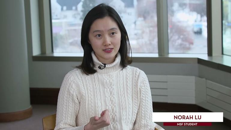 Student in turtleneck sweater speaking during interview
