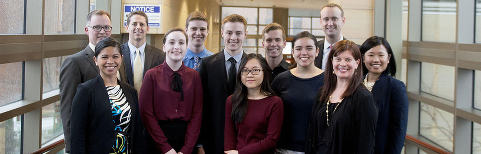 Senior Lecturer Rand Park (far left) and students (left to right) Katharine Hackney, Carter Weiss, Kyle Steinberg, Chau Mai, David Sebenaler, and Olivia Rao pose with representatives from Securian.