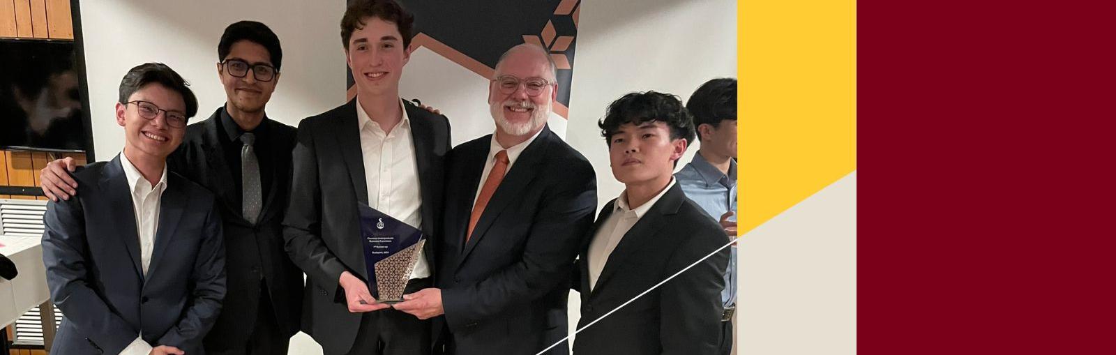 Carlson School students, pictured with faculty advisor Mike Grosso, at a case competition in Budapest, Hungary, after earning 2nd place overall.
