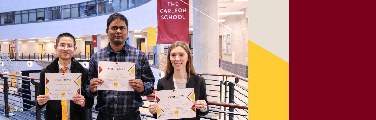 Quincy Gu, Shaquib Al Hasan, and Courtney Larson Cernohous hold their first-place certificates after winning the Interdisciplinary Health Data Competition.