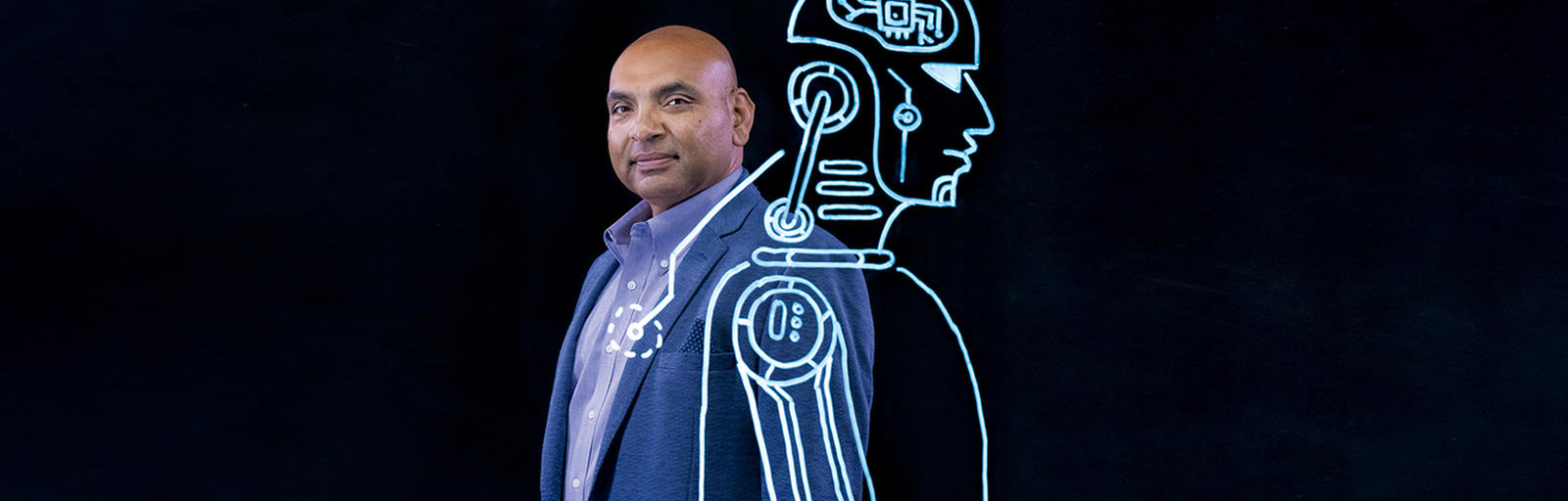 Professor Alok Gupta on black screen with a human body drawing overlaid on left shoulder.