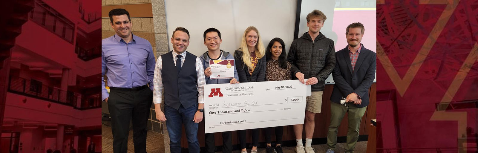 The Hackathon's winning team poses with a big check alongside members of the Minnesota Department of Human Services.