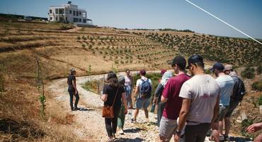 A group of graduate students tour farmland in Morocco.