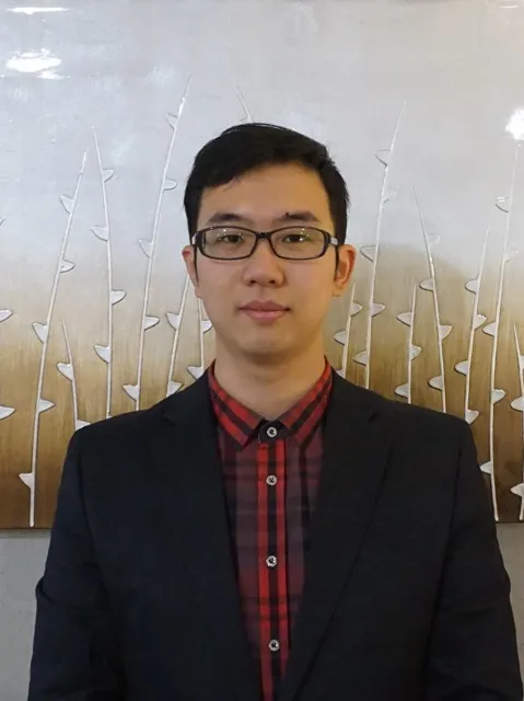 Xuan Bi smiling in a professional headshot photo 
