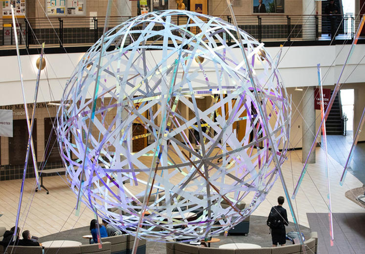 Globe structure inside the lobby of the Carlson School building.