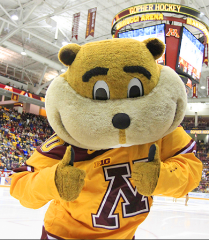 This is a placeholder photo of the Goldy Gopher mascot wearing an ice hockey jersey and standing on an ice hockey rink.