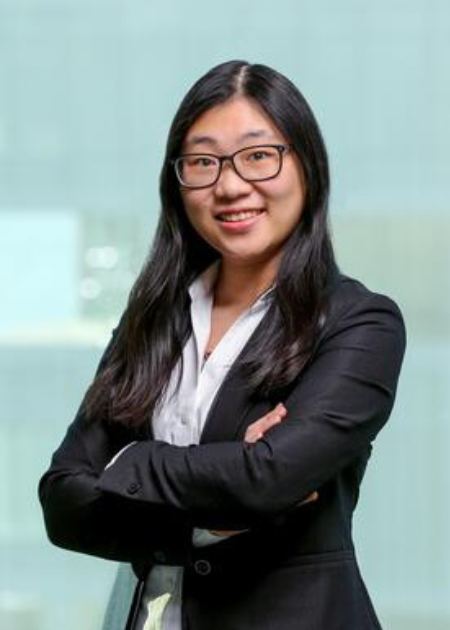 Jane Li, Columbia University. Finance seminar series. Jane Li is pictured, smiling at the camera. She has long black hair and glasses. She is wearing a black suit over a white blouse.