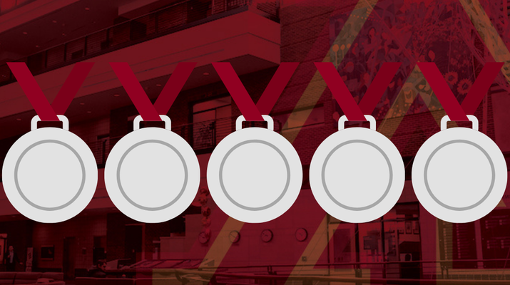 Maroon background with 7 medals: one gold, five silver, and one bronze.