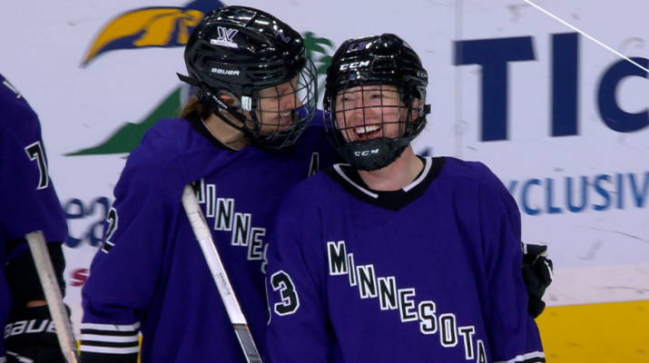 Grace Zumwinkle gets congratulated after scoring a ice hockey goal.