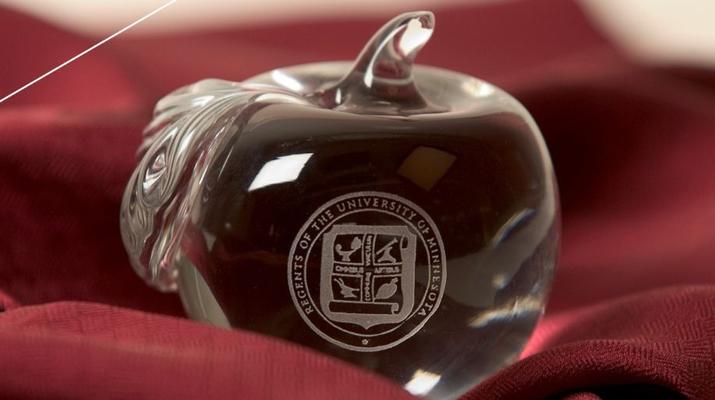 University of Minnesota Regents seal on crystal apple.