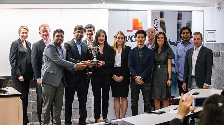 The winning team poses with PwC representatives and faculty and staff advisors.