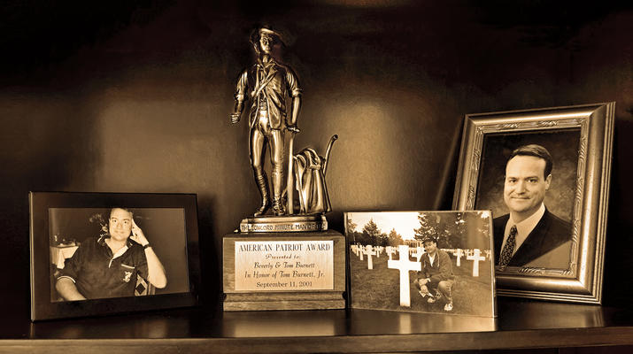 Pictures and awards on a table dedicated to Tom Burnett, ’86 BSB, a 9/11 hero.