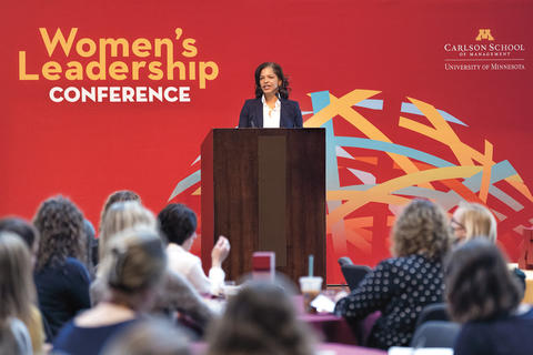 Speaker at podium at the Carlson School's 2022 Women's Leadership Conference.