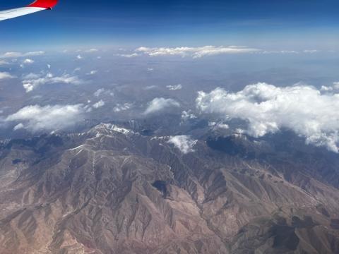 View of mountaneous terrain from airplane. 