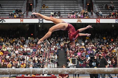 Lexy Ramler competes on the balance beam.