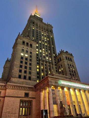 Palace of Culture and Science in Warsaw, Poland at night.