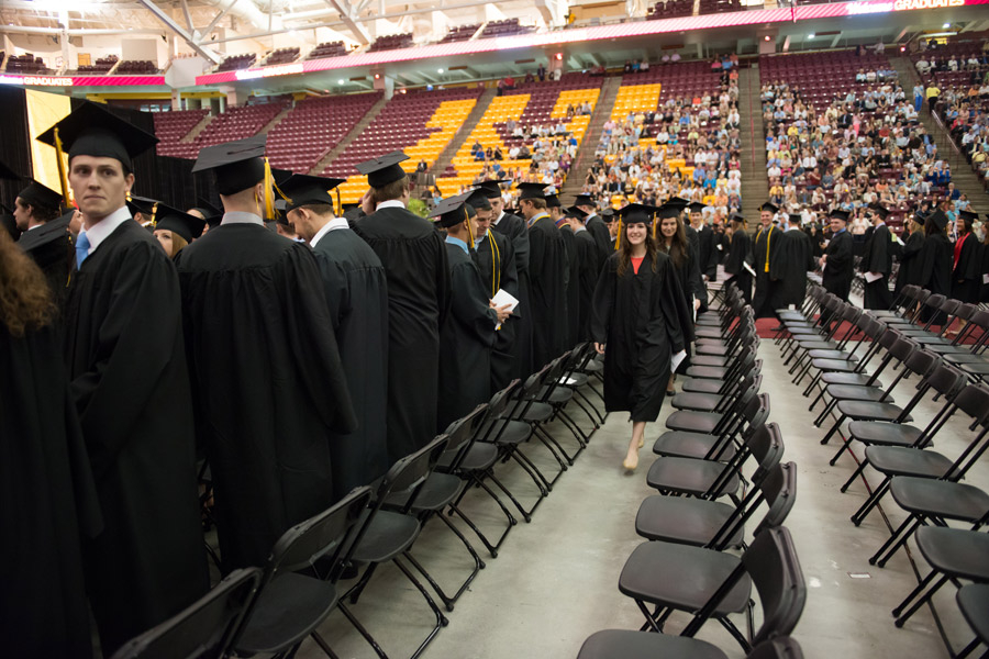 Students Filling in Seats at Undergraduate Commencement